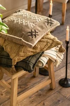 Stack of Decorative Rustic Pillows with Boho Textures and Embroidery Stock Photos