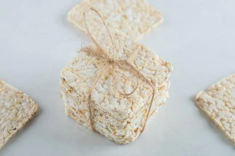 Stack of delicious airy crispbread on white background Stock Photos