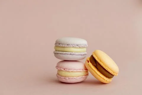 Stack of delicious almond macaroons on plain background, delicate dessert Stock Photos