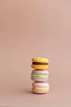 Stack of delicious almond macaroons on plain background, delicate dessert Stock Photos