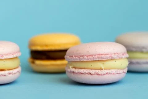 Stack of delicious almond macaroons on plain background, delicate dessert Stock Photos