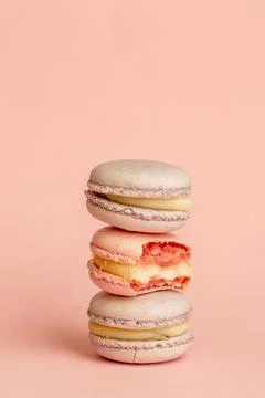 Stack of delicious almond macaroons on plain background, delicate dessert Stock Photos