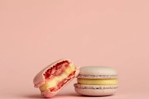 Stack of delicious almond macaroons on plain background, delicate dessert Stock Photos