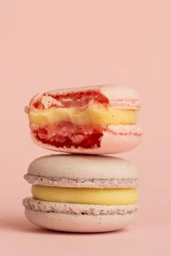 Stack of delicious almond macaroons on plain background, delicate dessert Stock Photos