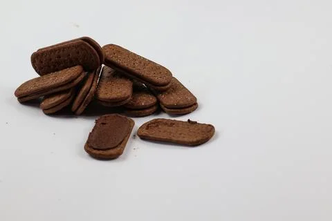 A stack of delicious brown wheat round biscuits with a few crumbs Stock Photos