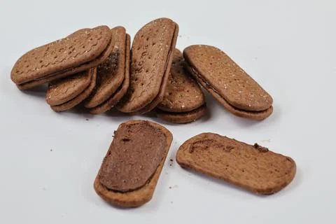 A stack of delicious brown wheat round biscuits with a few crumbs Stock Photos