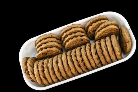 A Stack Of Delicious Chocolate Chip Cookies In Square Bowl Stock Photos