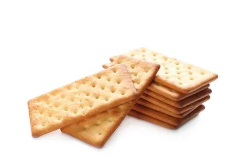 Stack of delicious crispy crackers isolated on white Foto stock