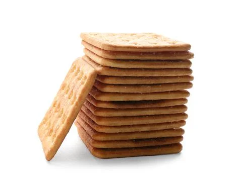 Stack of delicious crispy crackers isolated on white Stockfoto's