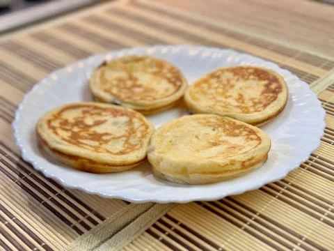 A Stack of Delicious Pancakes Presented on a Bright White Plate for Your Stock Photos