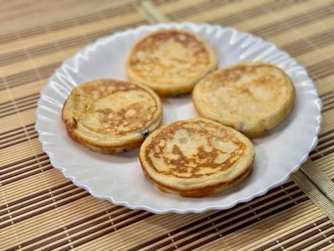 A Stack of Delicious Pancakes Presented on a Bright White Plate for Your Stock Photos