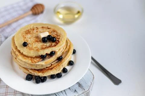 A stack of delicious pancakes with raspberries, blackberries and blueberries. Stock Photos