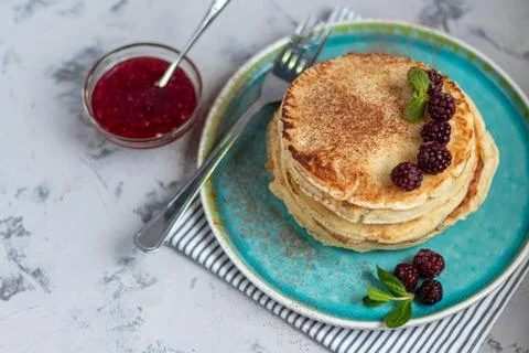 A stack of delicious pancakes with raspberries, blackberries and blueberries. 스톡 사진