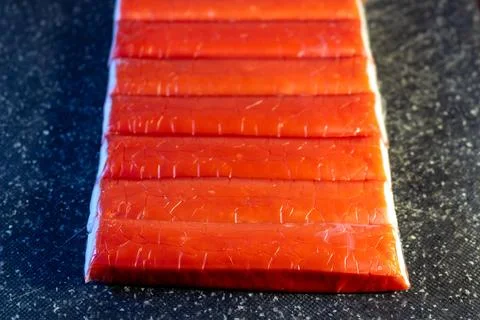A stack of delicious red traditional fruit paste on a dark surface Stock Photos