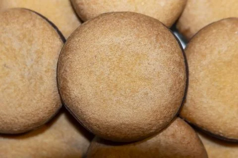 A stack of delicious round biscuits with chocolate glaze on dark background 写真素材