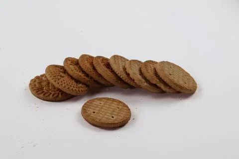 A stack of delicious wheat round biscuits with a few crumbs Stock Photos