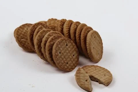 A stack of delicious wheat round biscuits with a few crumbs Stock-Fotos