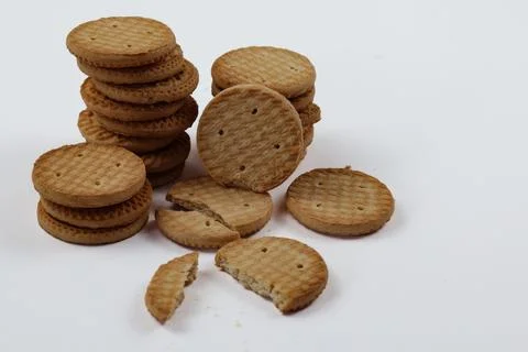 A stack of delicious wheat round biscuits with a few crumbs Stock-Fotos