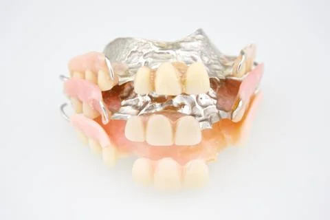 Stack of denture made from plastic and metal Stock Photos