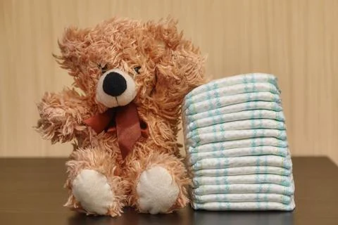 Stack of diapers or nappies with teddy bear Foto stock