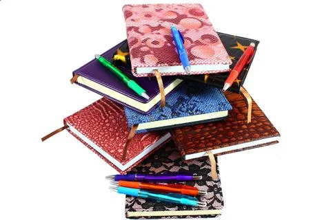 In a stack of diaries and pens Stock Photos