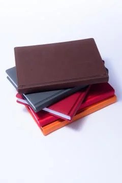 Stack of diaries top view on a white background Stock Photos