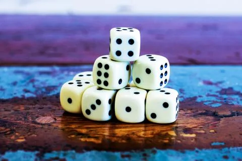 Stack of dice on old vintage table Foto stock