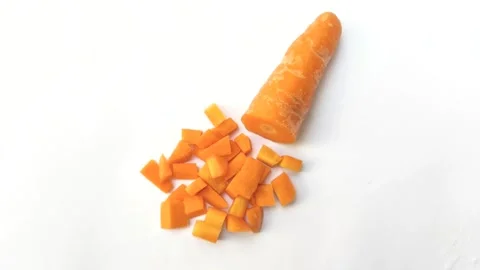 Stack of Diced Carrots on A White Background Stock Footage 279615282