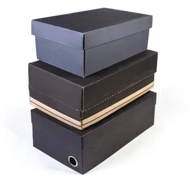 Stack of different black cardboard shoe boxes on white background 스톡 사진