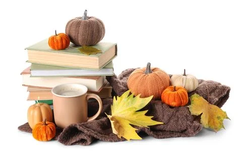 Stack of different books with burning candle, decorative pumpkins, cup of coc Stock Photos