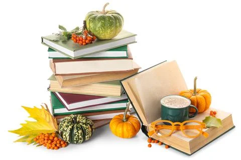 Stack of different books with pumpkins, cup of cocoa, eyeglasses, rowan berri Stock Photos