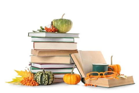 Stack of different books with pumpkins, cup of cocoa, eyeglasses, rowan berri Stock Photos