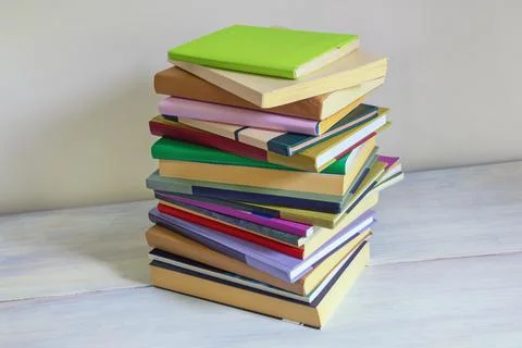 Stack of different books. Rustic background, space for text Stock Photos