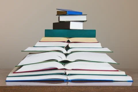 Stack of different books on the table. Free space for text Stock Photos