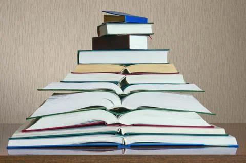 Stack of different books on the table Stock Photos