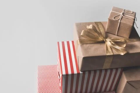 Stack of different christmas presents, isolated on grey Stock Photos