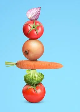 Stack of different fresh vegetables on light blue background 스톡 사진