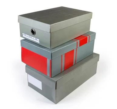 Stack of different gray cardboard shoe boxes on white background Foto stock
