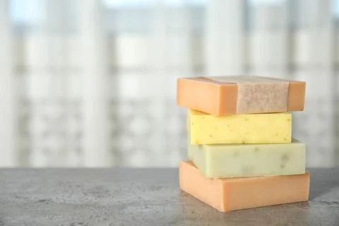 Stack of different handmade soap bars on table. Space for text 스톡 사진
