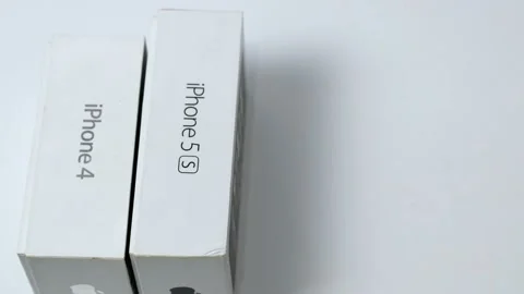 Stack of different iPhones 4, 5s, 6s, and others. A series of phones from Stock Footage 168379196