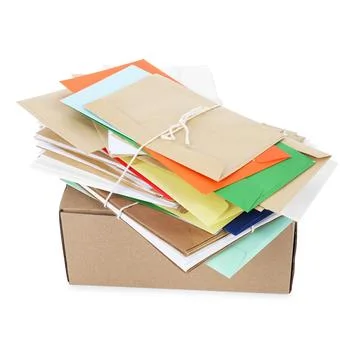 Stack of different paper envelopes and parcel on white background. Post offic Foto stock