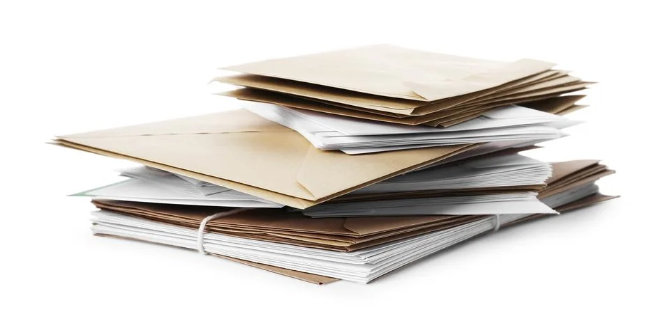 Stack of different paper envelopes on white background. Post office Foto stock