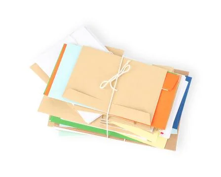 Stack of different paper envelopes on white background, top view. Post office Foto stock
