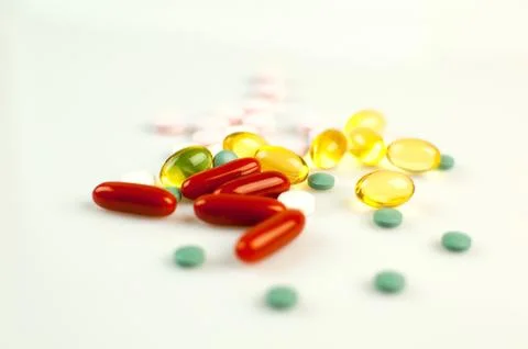 Stack of Different Pills Isolated on White Background. Pharmacy Concept. Stock Photos