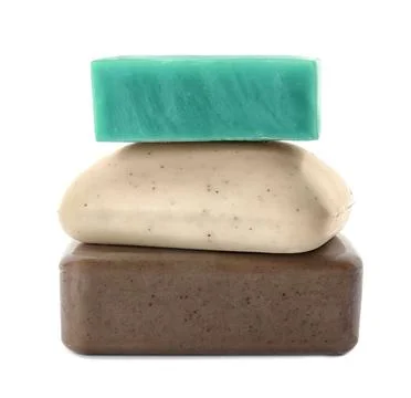 Stack of different soap bars on white background Foto stock