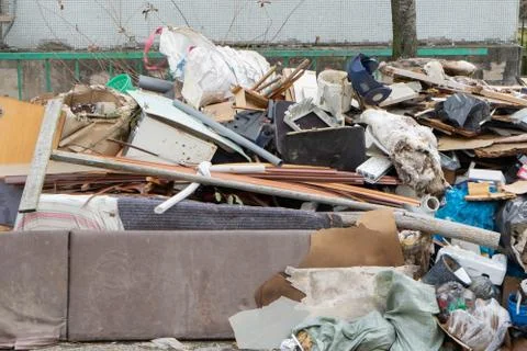 Stack of different types of large garbage dump, plastic bags, and trash bins  Stock Photos