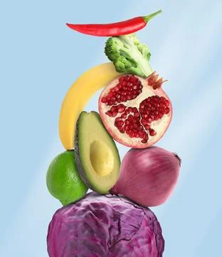 Stack of different vegetables and fruits on pale light blue background 스톡 사진