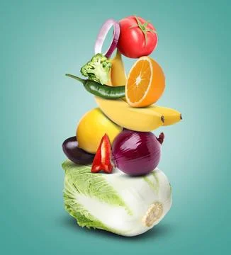 Stack of different vegetables and fruits on light sea green background 스톡 사진