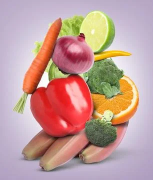 Stack of different vegetables and fruits on pale light violet background 스톡 사진