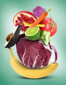 Stack of different vegetables and fruits on pale light teal background 스톡 사진